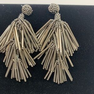 Silver dangle earring.